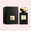 Armani Prive Oud Royal perfume bottle and packaging on a light pink background