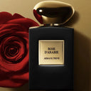 Perfume bottle of 'Rose d'Arabie' by Armani Prive with a red rose on a gold background