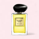 Perfume bottle labeled 'Orangerie Venise' by Armani on a pink background