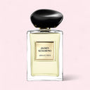 Perfume bottle labeled 'Jasmin Kusamono' by Armani Prive on a pink background