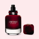 BEAUTE KNOWS Red Givenchy L'interdit Rouge Eau De Parfum 80ml perfume bottle with cap on a light pink background