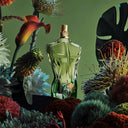 BEAUTE KNOWS Jean Paul Gaultier Le Beau Paradise Garden Eau De Parfum 125ml perfume bottle surrounded by tropical plants and flowers on a green background