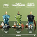 BEAUTE KNOWS Three Jean Paul Gaultier perfume bottles labeled 'Le Beau' with their respective scents and intensities on a green background.