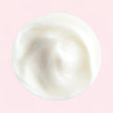 White cream content of Jo Malone London English Pear & Freesia Body Creme on a pink background