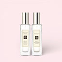 BEAUTE KNOWS Two Jo Malone London English Pear & Freesia 30ml cologne bottles on a pink background