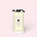 BEAUTE KNOWS Jo Malone London English Pear & Freesia Bath Oil 30ml bottle on a light pink background