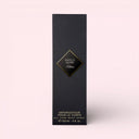 Black Kilian Angels' Share All-Over Body Spray 150ml packaging box with gold accents on a light pink background