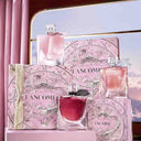 Lancôme La Vie Est Belle fragrance range perfume bottles and gift set packaging on a pink and gold background