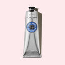 L'occitane 20% Shea Butter Hand Cream 150ml Tube on a light pink background