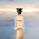 BEAUTE KNOWS Louis Vuitton L'Immensité Eau De Parfum 100ml perfume bottle on a reflective surface with blurred background