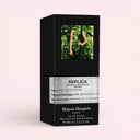 Maison Margiela Replica Fantasies Soul of The Forest Eau De Parfum 100ml packaging box on light pink background