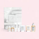 BEAUTE KNOWS Collection of Maison Margiela Replica fragrance, skincare products and advent calendar packaging box on a light pink background