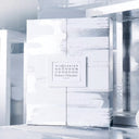Maison Margiela Replica Advent Calendar packaging with reflective surface and brand name.