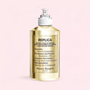 Gold Maison Margiela Replica By the Fireplace Eau de Toilette - Limited Edition 100ml perfume bottle with label on a pink background