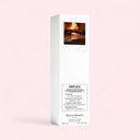 Maison Margiela Replica By the Fireplace Scented Diffuser 185ml packaging with fireplace image on a gradient pink background