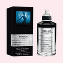 BEAUTE KNOWS Maison Margiela Replica Celestial Whisper perfume and black packaging on light neutral pink background