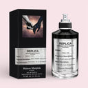 Maison Margiela Replica Fantasies Ideal One Eau De Parfum 100ml perfume bottle and packaging box on light pink background