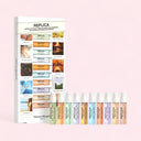 Maison Margiela Replica Memory Box Exploration Set mini travel sized pen spray bottles with packaging on a pink background