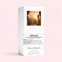 Maison Margiela Replica On A Date Eau de Toilette 100ml perfume packaging on light pink background