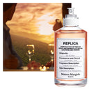 Maison Margiela Replica On A Date Eau de Toilette 100ml perfume bottle with background of sunset and wine yard