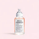 Maison Margiela Replica On A Date Eau de Toilette 30ml perfume bottle on a pink background