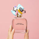 Marc Jacobs Perfect Eau de Parfum 50ml perfume bottle with colorful cap on a pink background