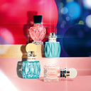 Collection of colorful Miu Miu perfume bottles on a vibrant, abstract background