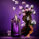 Purple Mugler Alien Refillable Eau de Parfum 60ml perfume bottle with flowers on a purple background