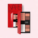 NARS Light Reflecting™ Travel Face Palette Limited Edition with red packaging on a light pink background