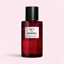 Red  N°1 DE CHANEL L'EAU ROUGE REVITALISING FRAGRANCE MIST bottle with black cap on a light pink background