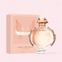 Paco Rabanne Olympéa Eau de Parfum 50ml perfume bottle and packaging on a pink background