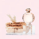 Paco Rabanne Olympéa Eau de Parfum 50ml perfume bottle labeled 'Olympea' on a pink background