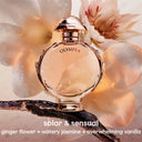 Paco Rabanne Olympéa Eau de Parfum 50ml perfume bottle labeled 'Olympea' with flowers and vanilla bean on a soft background
