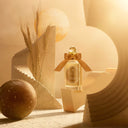 Penhaligon's Solaris Eau de Parfum 100ml perfume bottle with a gold bow in a warm, beige-toned setting