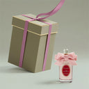 Penhaligon's The Favourite Eau de Parfum 100ml perfume bottle with pink bow and matching gift box on a light gray background