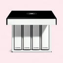 Set of 4 Chanel ROUGE ALLURE VELVET NUIT BLANCHE lipsticks in a black and white case on a pink background