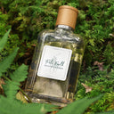 Ralph Lauren Polo Earth Eau de Toilette 100ml bottle with wooden cap on a green leafy background
