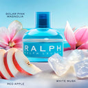 Ralph Lauren Ralph Eau de Toilette 50ml perfume bottle with pink flowers, red apples, and white crystals on a blue background