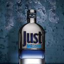 Bottle of Roberto Cavalli Just Cavalli For Men Eau de Toilette 50ml perfume with a blue and silver design on a textured blue background