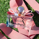 Salvatore Ferragamo Signorina Eau de Parfum 30ml perfume bottle with pink ribbon on grass