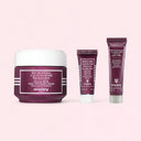 Sisley à La Rose Noire | Black Rose Skin Infusion Cream Discovery Set products on a pink background