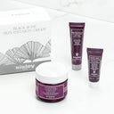 Sisley skincare products including a jar, two tubes, and a box on a white background