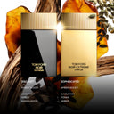 Tom Ford Noir Extreme Eau De Parfum and Tom Ford Noir Extreme Parfum perfume bottles with text of scent profile, amber and wood elements in the background