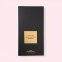 BEAUTE KNOWS Black and gold Tom Ford Black Orchid Reserve Parfum 100ml perfume box on a light pink background
