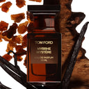 BEAUTE KNOWS Brown Tom Ford Myrrhe Mystère Eau De Parfum 50ml perfume bottle with amber resin and vanilla beans on a white background