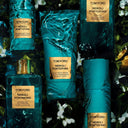 Tom Ford Neroli Portofino range products with water and floral background