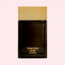 BEAUTE KNOWS Brown Tom Ford Noir Extreme Eau De Parfum 100ml perfume bottle with gold cap on a light pink background