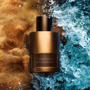 Tom Ford Oud Minérale Eau de Parfum 50ml perfume bottle on a textured background