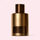 Bronze Tom Ford Oud Minérale Eau de Parfum 100ml perfume bottle on a light pink background
