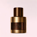 Tom Ford Oud Minérale Eau de Parfum 50ml perfume bottle on a light pink background
